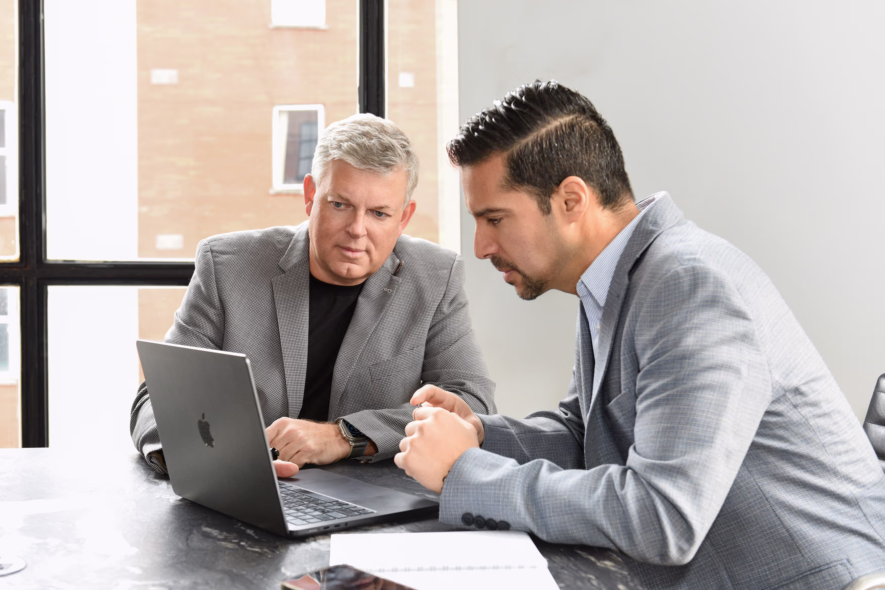 Executive Coach and Client deeply engaged in work.