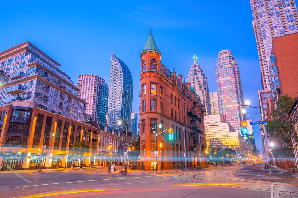 Toronto Flatiron Building near Financial District, symbolizing executive leadership and business growth.