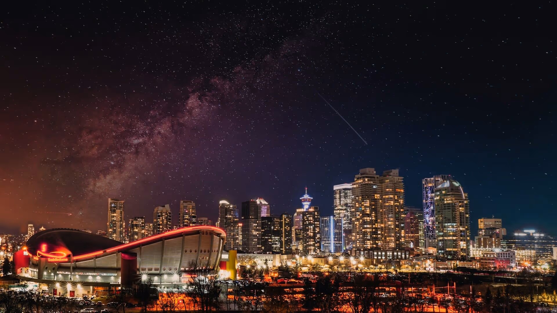 Calgary Saddledome and Calgary Tower skyline — representing local leadership and business growth