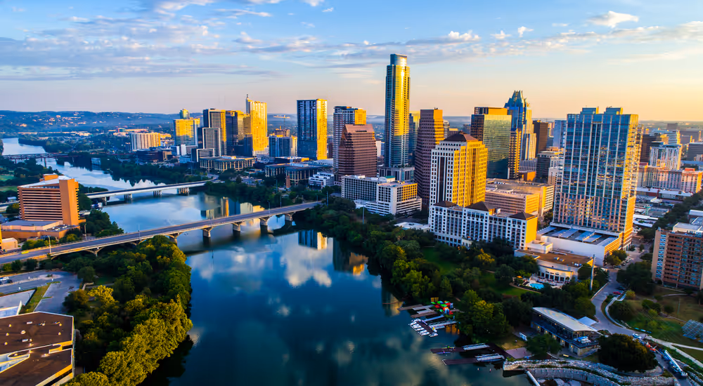 Skyline of Austin, Texas with water in foreground — reflecting growth and clarity for business leaders