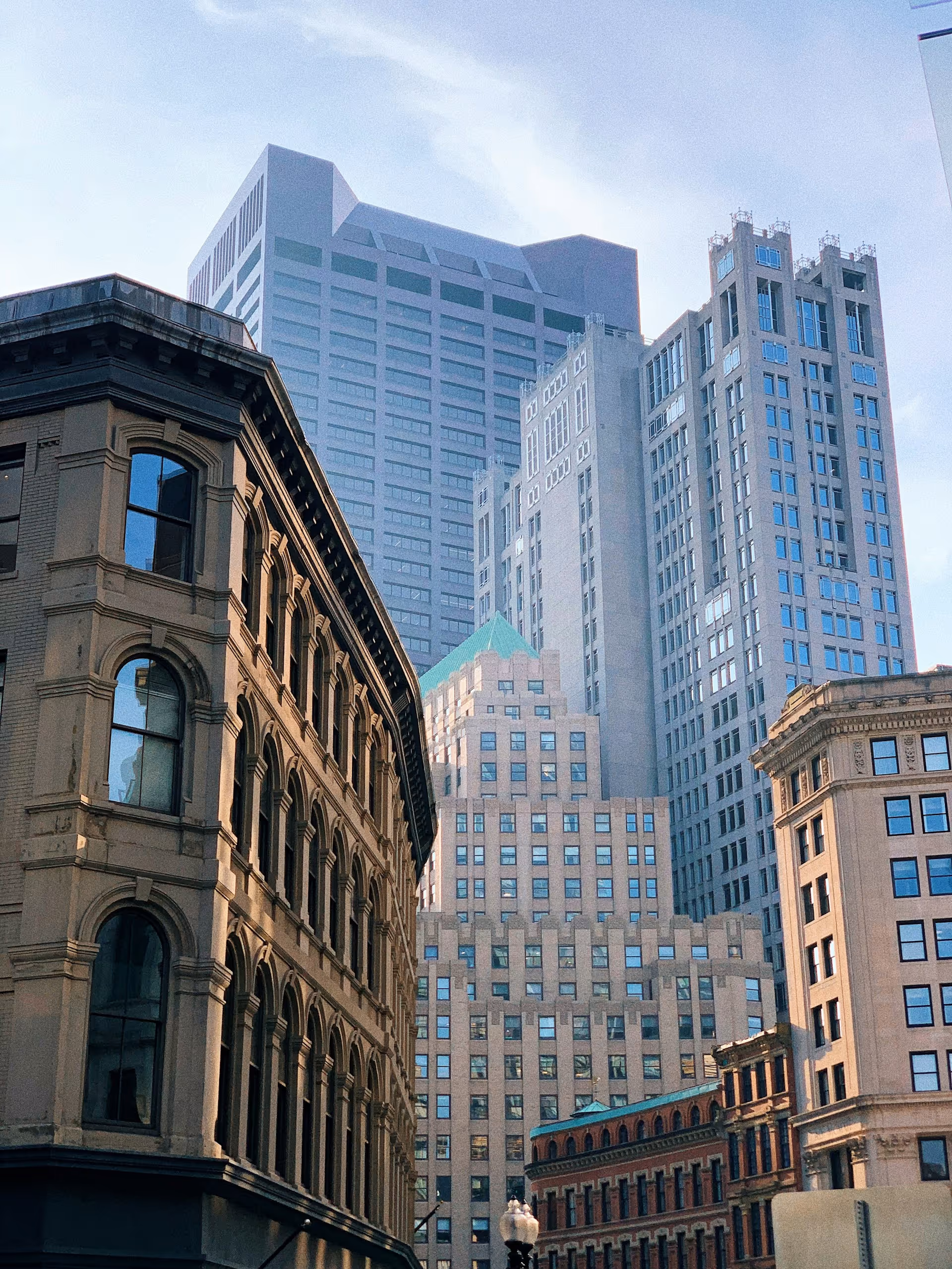 Boston’s historic and modern downtown buildings — symbolizing leadership at the intersection of tradition and transformation
