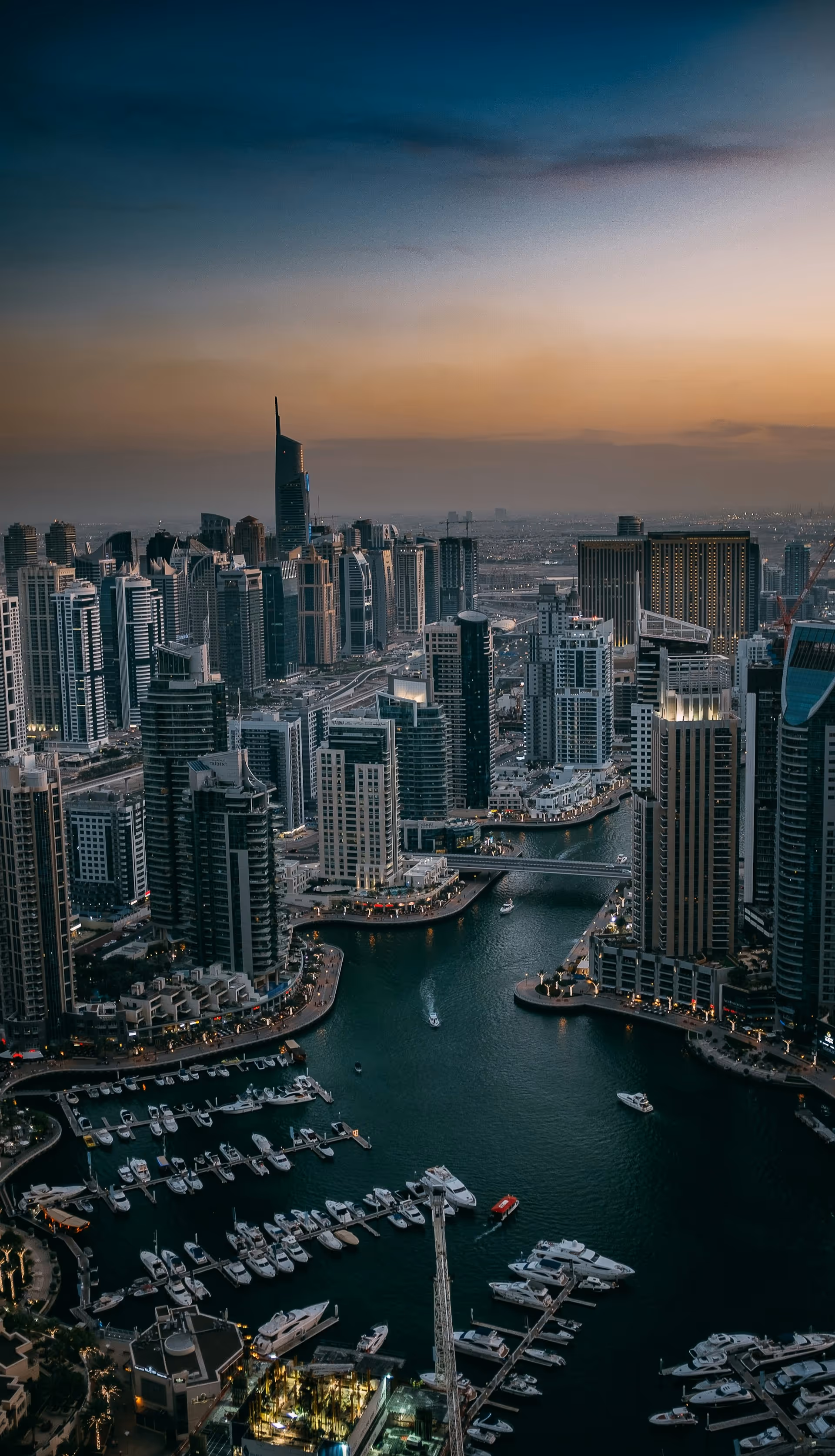 Portrait view of Dubai’s skyline with water in foreground — symbolizing clarity, ambition, and global business leadership