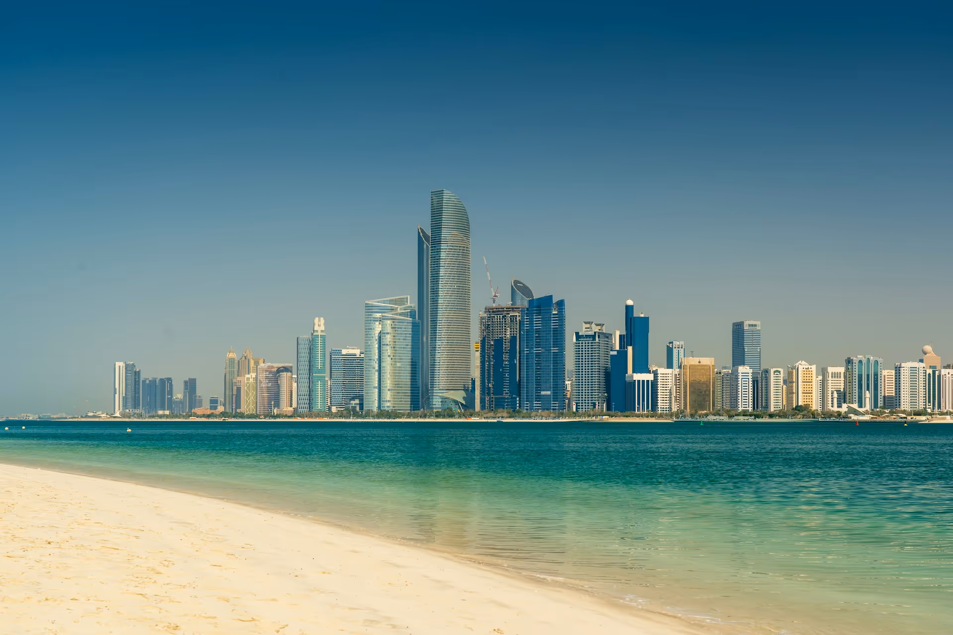 Blue-water view of Abu Dhabi’s business district — reflecting thoughtful leadership and executive focus